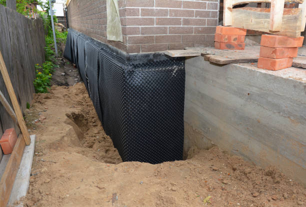 SJ Waterproofing Pros technician performing targeted Exterior Waterproofing assessment in Locust Grove, VA
